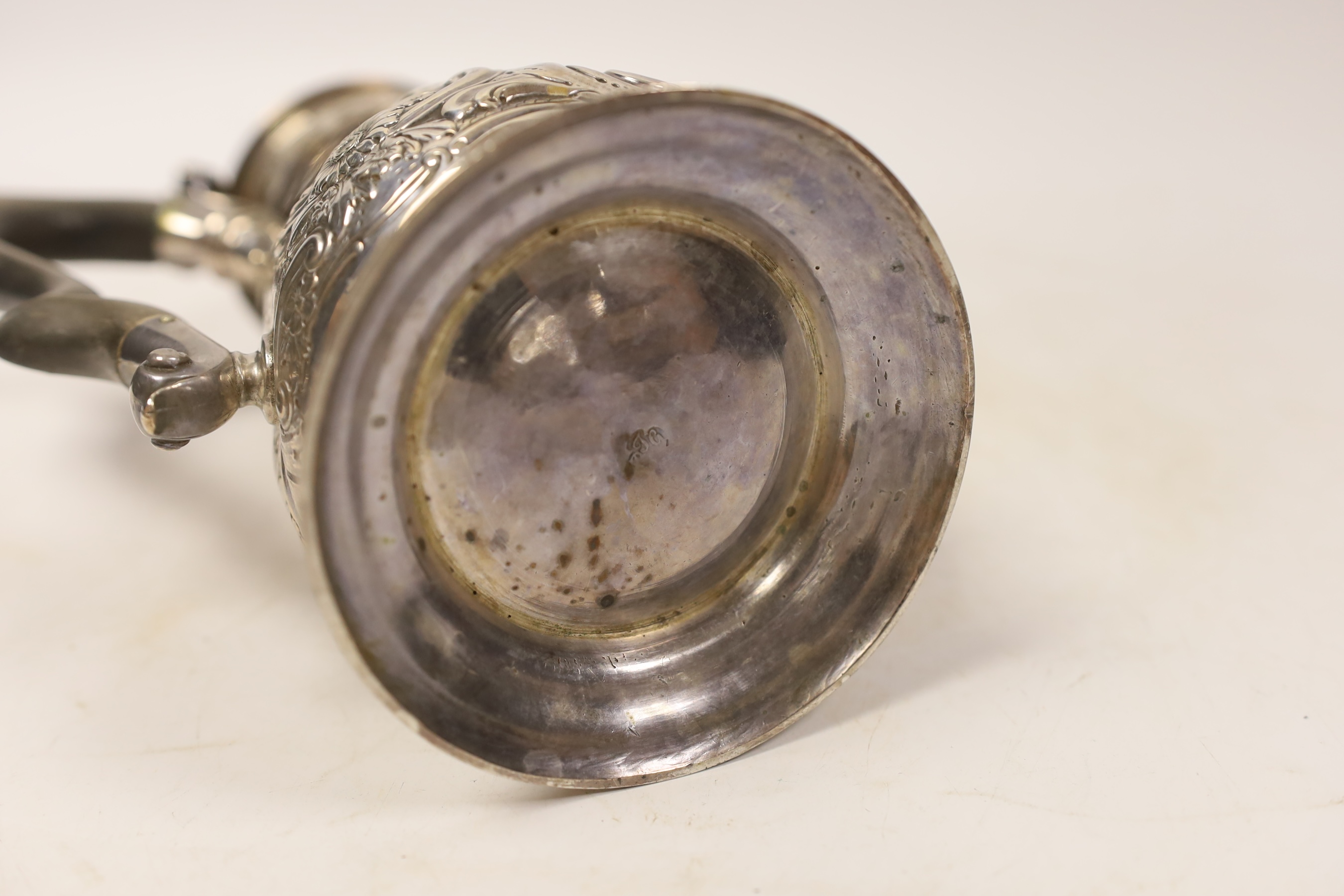 A George II silver coffee pot, with later embossed decoration, by Gurney & Cook, London, 1749m height 23.3cm, gross weight 22.2oz.